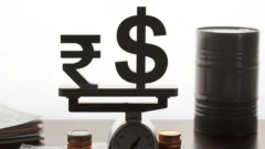 Rupee and dollar symbols on a scale beside an oil barrel, representing the rupee's early trade gain