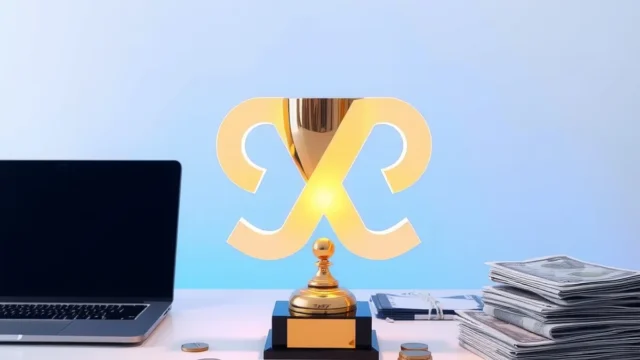 Trophy beside a laptop with abstract digital shapes, representing a regulator technology hackathon win